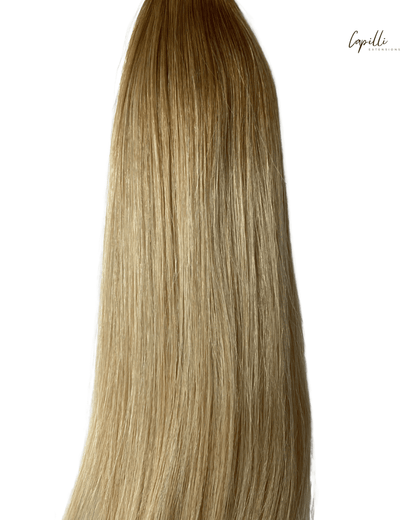 Ombre weave extensions van Capilli Extensions met gradiënt kleuren en natuurlijke textuur, geschikt voor verlenging en styling.