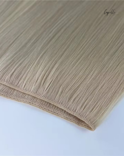 Triple weave extensions los afgebeeld in blonde haarkleur