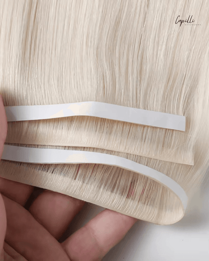 Close-up invisible skin tape extensions blond haar