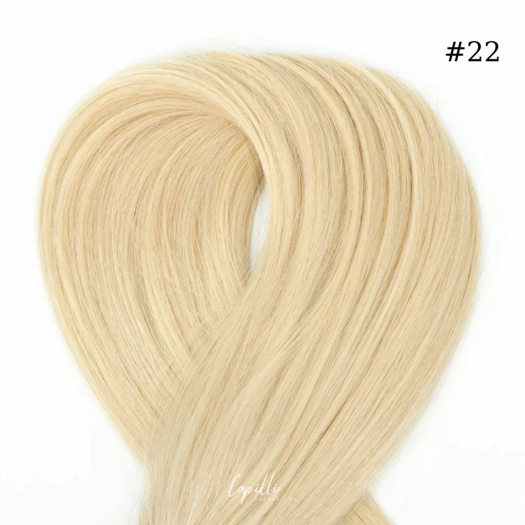 Ponytail extensions in blonde color #22, made from premium 100% human remy hair, available in 100g to 250g, length 30cm to 76cm.